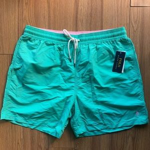 teal and light pink swim trunks
